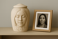 Personalized 3D memorial urn with a serene face sculpted in resin, resembling a loved one. Custom handmade urn by Always With Me.
